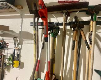 Garage filled with Christmas, furnishings, smoker, pressure washer and tools 