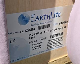 Earthlite Pegasus massage table. Adjustable, with head rest and knee roll.