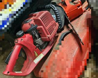 couple of chain saws not in a case