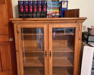 Nice cabinet with glass doors, Monk figure, Monk books