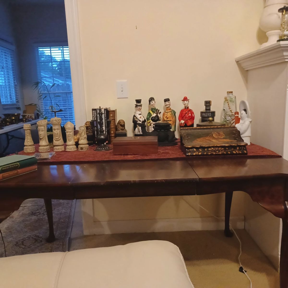 Decorative chess pieces, empty collectible liquor bottles and other items.