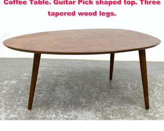 Lot 486 Tri Leg Modernist American Modern Coffee Table. Guitar Pick shaped top. Three tapered wood legs. 