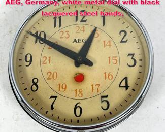Lot 562 Peter Behrens, Electric Wall Clock, AEG, Germany, white metal dial with black lacquered steel hands,