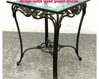 Lot 81 Glass Top Metal Frame Table. Leaf deign with gold paint finish. 