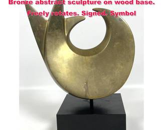 Lot 169 Michael Katz 418 Heavy Solid Bronze abstract sculpture on wood base. Freely rotates. Signed. Symbol