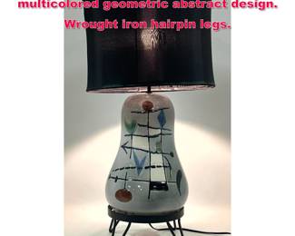 Lot 11 Glazed ceramic lamp with multicolored geometric abstract design. Wrought iron hairpin legs. 