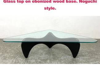 Lot 418 Mid Century Modern Coffee Table. Glass top on ebonized wood base. Noguchi style.
