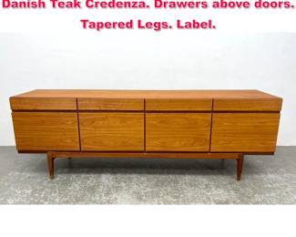 Lot 294 IB KOFOD LARSEN for FAARUP Danish Teak Credenza. Drawers above doors. Tapered Legs. Label. 