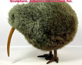 Lot 476 Whimsical Wood and Plush KIWI Sculpture. Appears to me lamb fur.