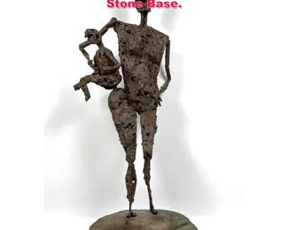 Lot 332 Brutalist Iron Figural Sculpture on Stone Base. 