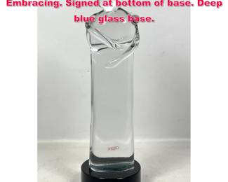 Lot 135 Ogetti glass sculpture. Couple Embracing. Signed at bottom of base. Deep blue glass base.