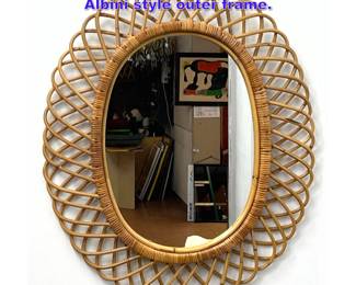 Lot 1056 Oval wicker rattan mirror with Albini style outer frame. 