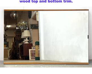 Lot 987 Mid Century Modern Wall Mirror. wood top and bottom trim.