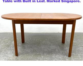 Lot 608 Danish Modern Denmark Teak Dining Table with Built in Leaf. Marked Singapore.