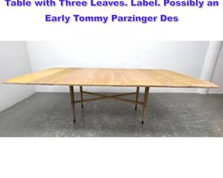 Lot 1061 Charak Modern Drop Leaf Dining Table with Three Leaves. Label. Possibly an Early Tommy Parzinger Des
