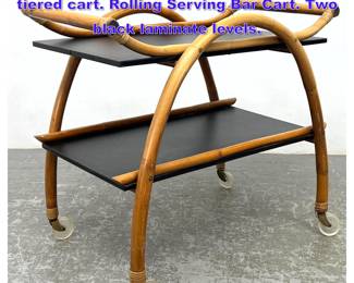 Lot 1047 Vintage Modernist Bamboo two tiered cart. Rolling Serving Bar Cart. Two black laminate levels. 