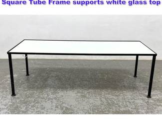 Lot 658 Modern Design Coffee Table. Black Square Tube Frame supports white glass top