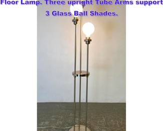Lot 790 Chrome and Stainless Contemporary Floor Lamp. Three upright Tube Arms support 3 Glass Ball Shades.