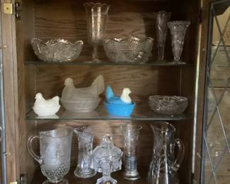 Glass chickens, some cut glass