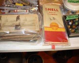 Old travel maps, stereopticon cards, a few very old marbles  
