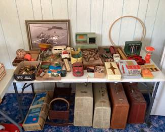 Vintage luggage, old toys, metal cars