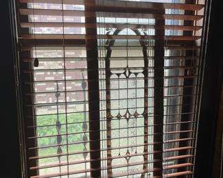 One of pair of matching stained glass panels