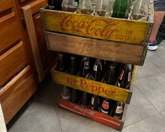 Vintage collectable Coke, Dr Pepper, and misc soda bottles and crates 