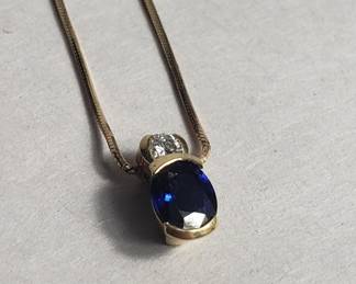 Lot # : 43 - 14k gold necklace with diamond and sapphire

