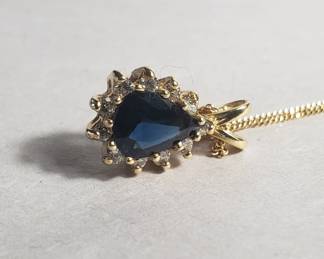 Lot # : 41 - 14k gold necklace with diamond and blue sapphire
