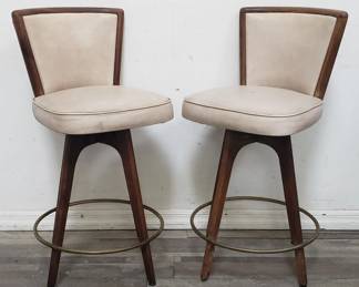 Lot # : 161 - Pair of mid century modern faux leather bar stools
