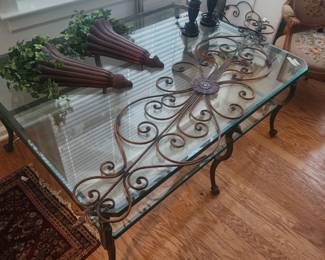 Beautiful glass top wrought iron coffee table ( cost over 1k new) has birds on it at every corner. Exceptional table if you have a large living room or den.