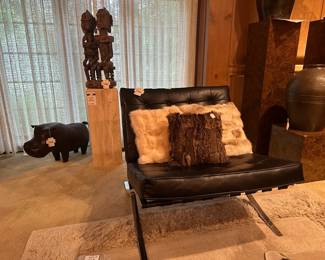 Faux Knoll Barcelona Chair (A) , Faux fur decorative pillows , African Tribal Seated Couple Sculpture 