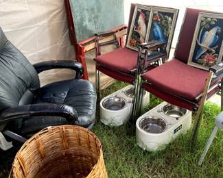 Stackable chairs, raised pet bowls, an old chalk board easel and those birds!