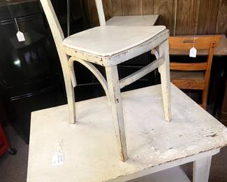 This is a great distressed painted table with a cool chair!