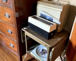 Painted typewriter table, portable record player.