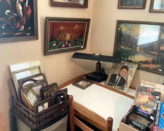 Flip top art table, more paintings, cool desk lamp.