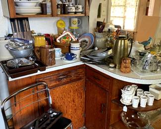 Kitchen is PACKED with dishes, utensils, serving pieces, etc.