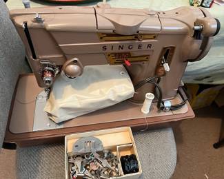 Singer sewing machine plus implements (around the 70's)