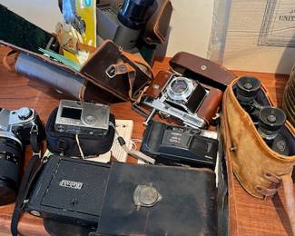 Collection of vintage cameras: Eastman Kodak No. 1A Autographic /1914, Yashica T3 Super D 35 mm Point & Shoot Film Camera Carl Zeiss Tessar Lens, Canon Powershot digital Elph S230, Canon AE-Program SLR 35 mmm, etc...