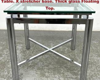 Lot 1288 Modernist Chrome and Glass Side Table. X stretcher base. Thick glass Floating Top. 