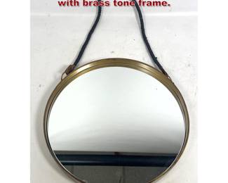 Lot 1213 Round Braided Leather strap mirror with brass tone frame.