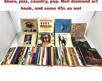 Lot 1669 70 vinyl records mix of rock, blues, jazz, country, pop. Neil diamond art book, and some 45s as wel