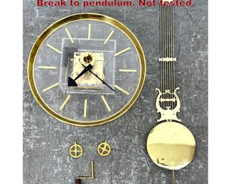 Lot 1705 Howard Miller Lucite Wall Clock. Break to pendulum. Not tested.