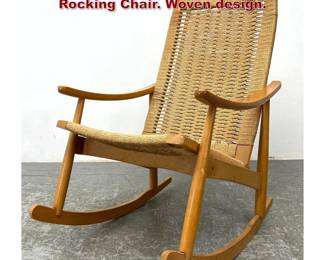 Lot 1299 Mid Century Modern Wegner Style Rocking Chair. Woven design.