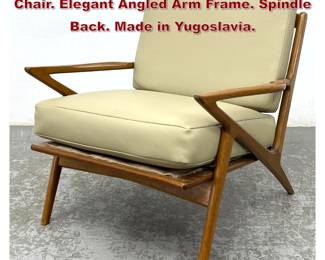 Lot 1406 Poul Jensen style Walnut Lounge Chair. Elegant Angled Arm Frame. Spindle Back. Made in Yugoslavia. 