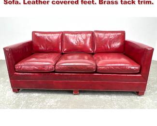 Lot 1381 Red Leather Three Seater Couch Sofa. Leather covered feet. Brass tack trim. 