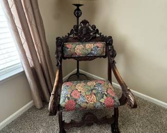 Upholstered antique carved wood chair