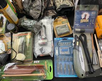 Tables full of NOS hunting & fishing gear 