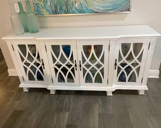 White cabinet with glass doors, Home Again Wilmington. 