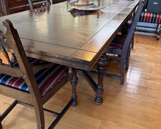 Antique Dining set with butterfly leaf extensions and 6 chairs. Includes table cover.